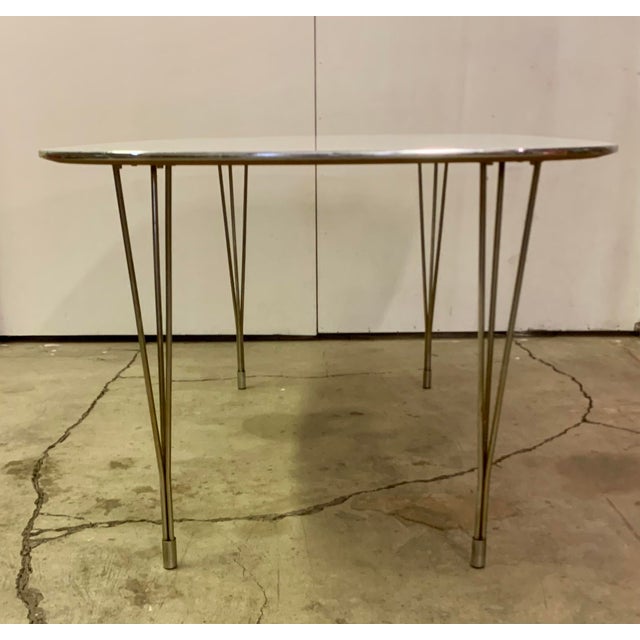 Fritz Hansen dining table (model super elliptical) In the style f Piet Hein and Bruno Mathsson in 1960. This design...