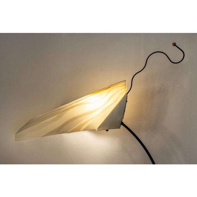 Floor lamp with metal frame and folded plastic diffuser. Sister model Designer: Riccardo Dalisi Manufacturer: Oluce Year:...