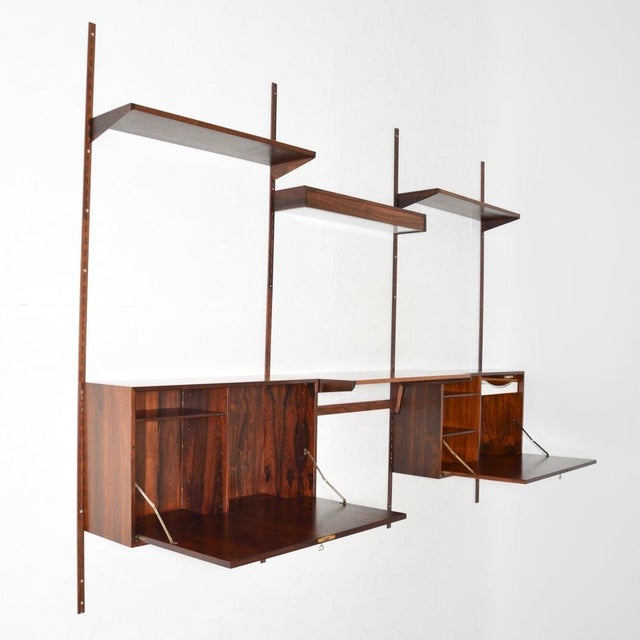 A superb danish vintage wall mounting shelving system. This was made in denmark by fm mobler, it dates from the 1960’s....