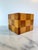 A striking vintage handcrafted desk accessory featuring a bold, geometric checkerboard pattern. This cube-shaped vessel is...