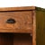 A handsome antique general store counter featuring five small drawers above open cubby compartments. Crafted from solid...