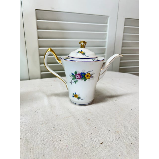 Limoges France floral pattern teapot. Marked Limoges France. Measures 8.5” w x 5” d x 7” h.