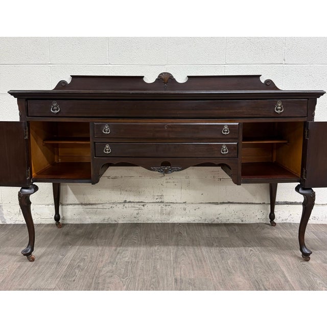 This is a beautiful vintage Georgian Revival mahogany sideboard, buffet, or console, likely from the 1930s. This finely...