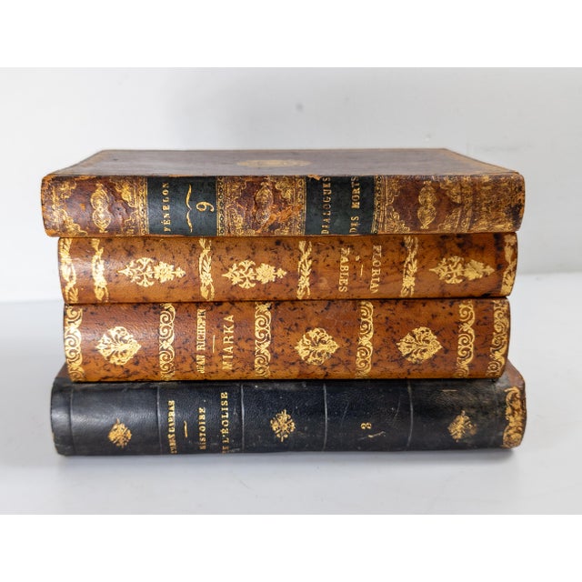 We are selling this great decorative French Faux leather bound book set. This stack of four books in wood and with leather...