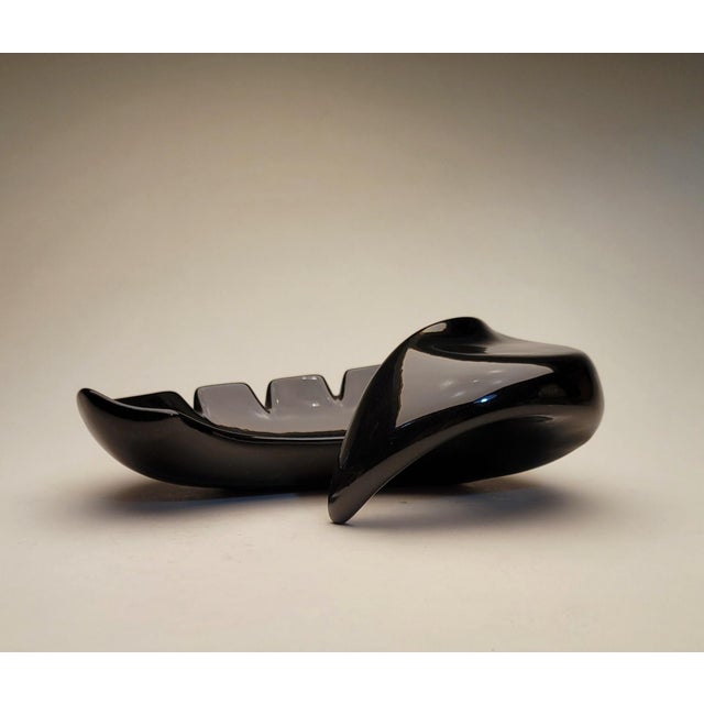 Unique mod atomic curvy shaped black ceramic ashtray dated December 13, 1966 and marked Pat House. Very cool shape, a...