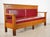 Mission style solid oak high back bench with egg & dart detail. The cushions are likely red naugahyde vinyl with no tears....