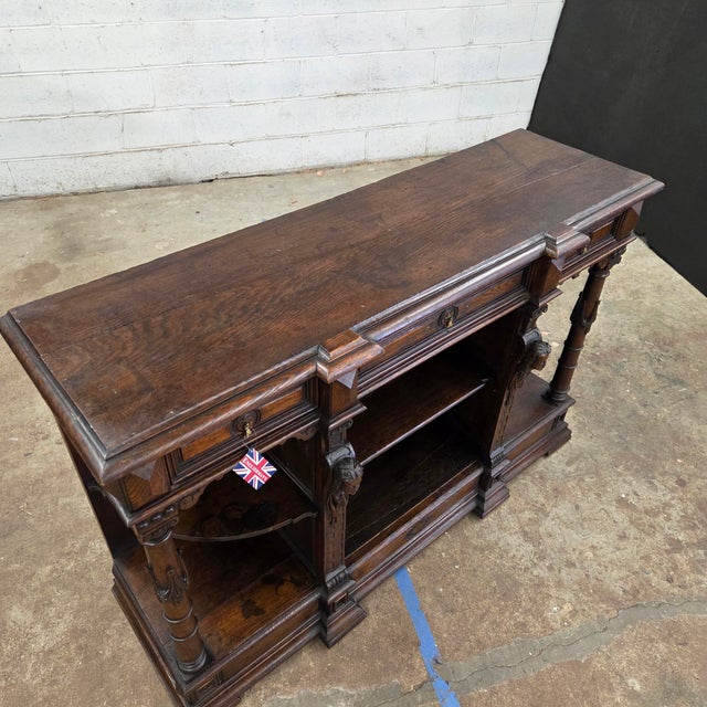 This Oak Antique Jacobean Style Walnut Buffet With Ornate Carved Legs, Drawers, & Open Shelving would be a beautiful entry...