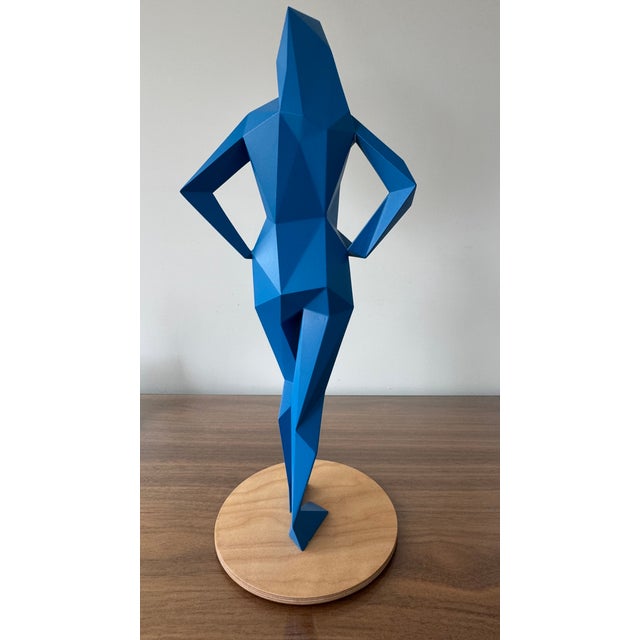 This is a polyurethane resin sculpture painted with polyurethane paint, mounted on a wooden base. It measures...