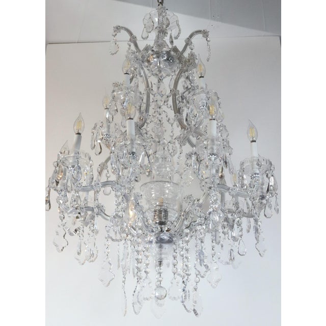Mid to late 20th century Marie Therese style chandelier with octagon, teardrop, floral rosette, and pendeloque shaped...