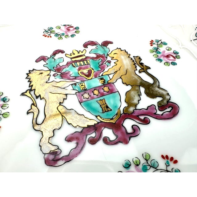 This Andrea by Sadek decorative dish, adorned with a hand-painted coat of arms, is a work of art. The dish's elegant...