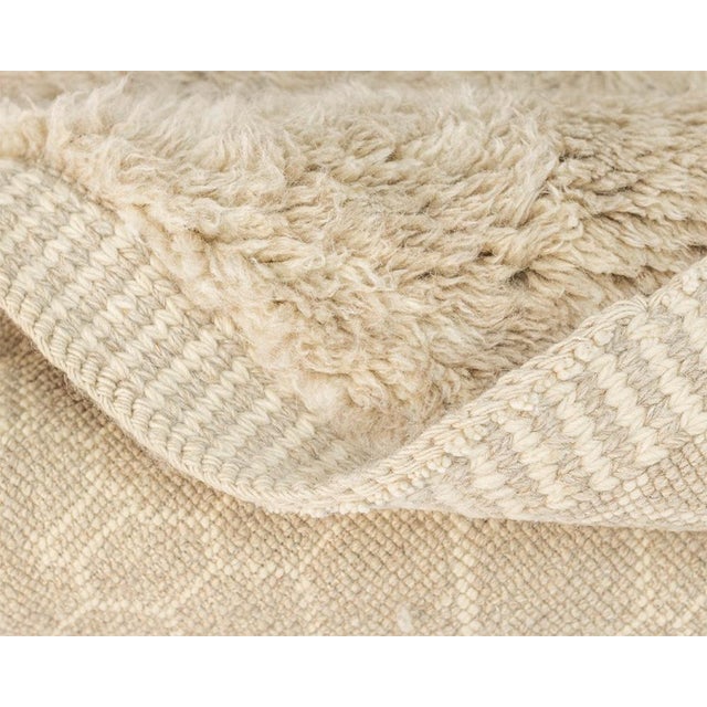 Elegant wool runner rug meticulously Hand-knotted, showcasing a delicate organic pattern. The soothing Oatmeal color adds...