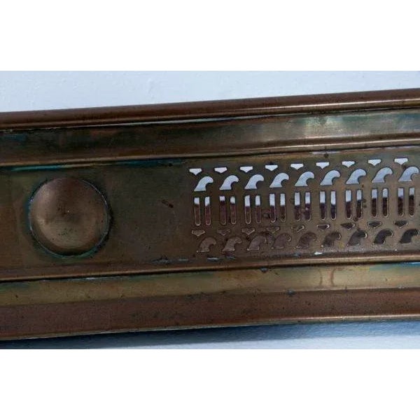 A very nice looking mid 19th Century English brass fire fender decorated in neoclassical motifs. We think this piece dates...