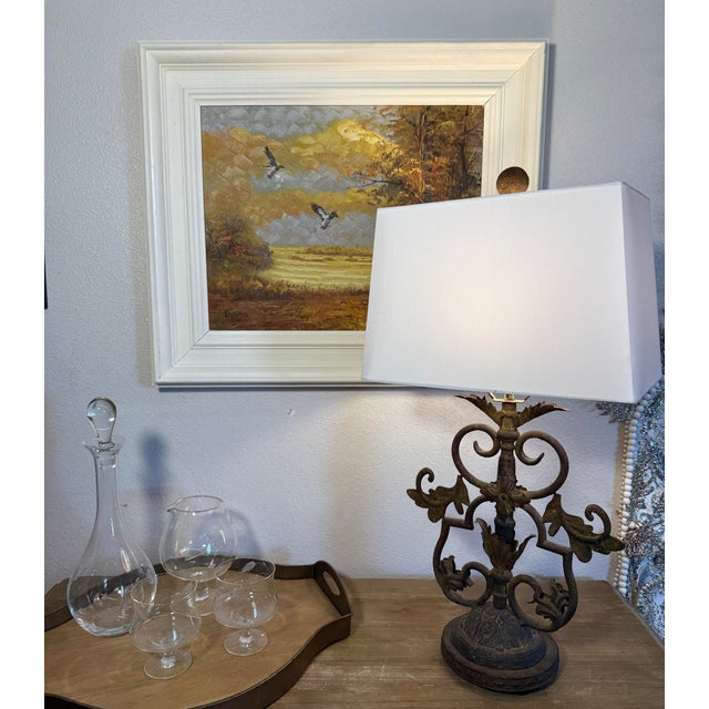 Iron work table lamp in antique iron finish. 41” to top of finial. 13” wide.