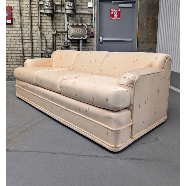 Postmodern three-seat sofa by Americans of Martinsville, produced in the 1980s. The piece features a softly structured...