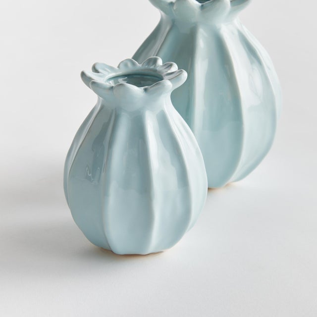With a sculpted body and thicklyapplied reactive glaze, this pair of bud vases is a work of art. The handfinished details...
