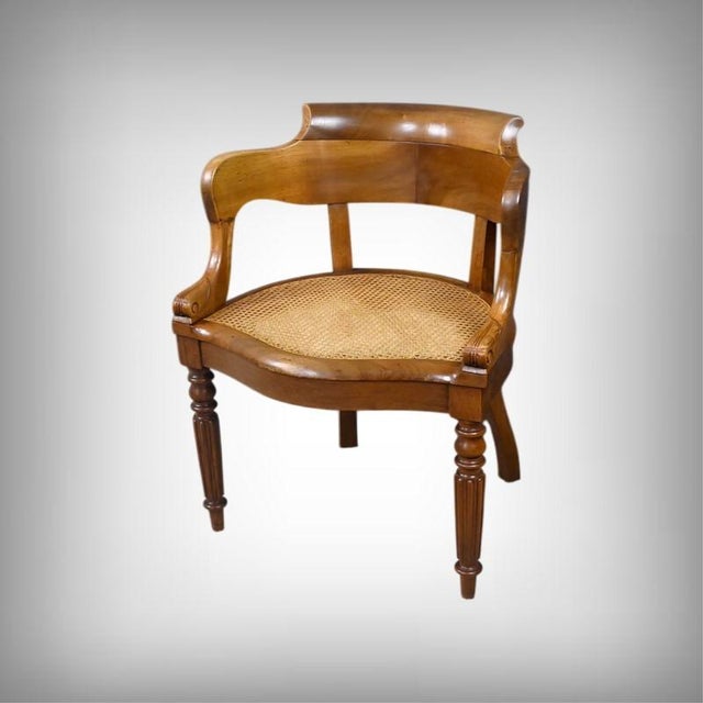 This Louis-Philippe period walnut office chair captivates with the refined balance of its lines and the luminosity of its...
