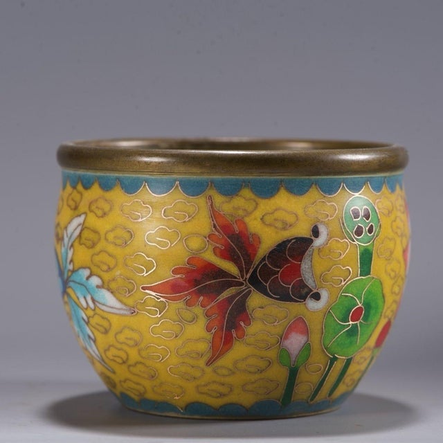 This vibrant vintage bowl is a beautiful example of traditional cloisonné enamel craftsmanship. The piece features a...