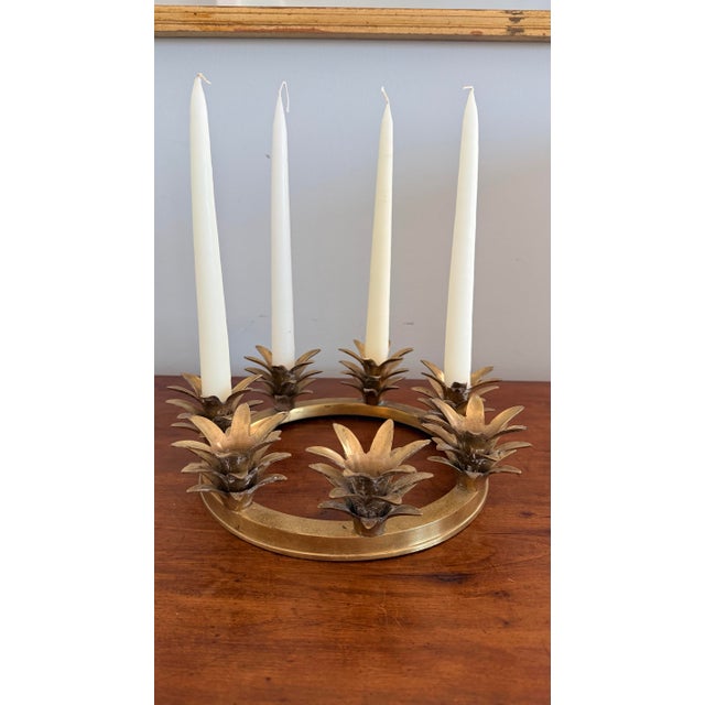 Decorative brass pineapple centerpiece candle holder. Makes a wonderful accent piece for a creative tablescape.