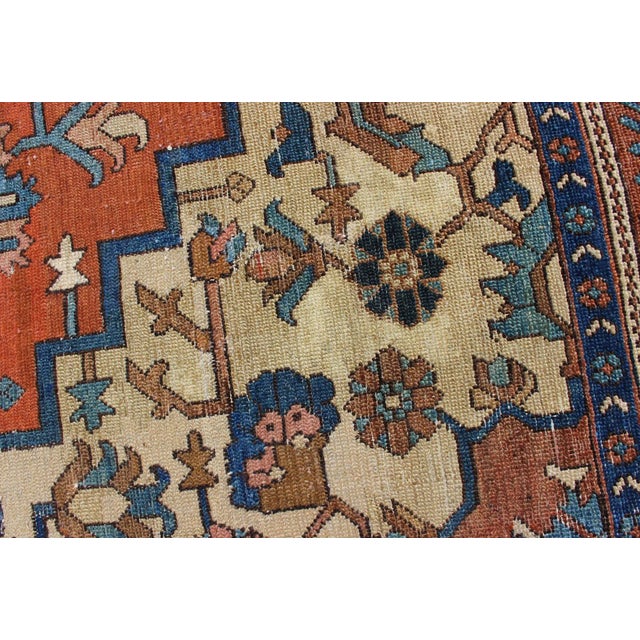 Antique Persian Serapi rug with colorful and detailed layered medallion in Rust, Orange, ivory & medium blue, light green,...