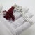 This vintage silver reading accessory depicts an elegant bookmark finished with a decorative red tassel, crafted as a...