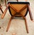 Six elegant rosewood dining chairs designed by Harry Østergaard, featuring a sculpted bentwood backrest and round tapered...