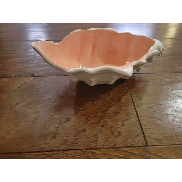 This little shell bowl would work as a candy, chocolate, or condiment dish. Ot would even be useful for low floral...