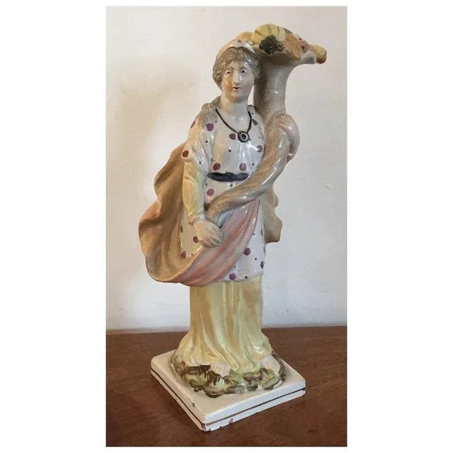 Large antique 19th c. Staffordshire pearlware figure of Ceres - Roman Goddess of Agriculture. She holds an exaggerated...