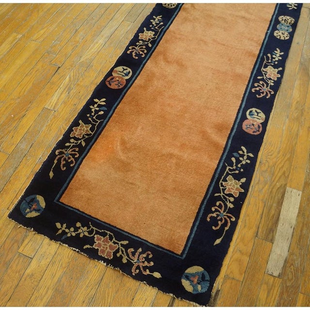 Antique Chinese - Peking Hallway Runner Wool Coral Rug, Circa Date: 1920s. This exceptional example of early 20th-century...