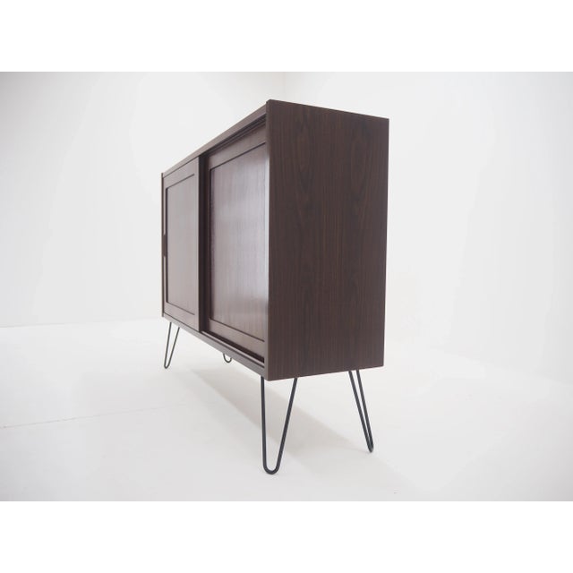 The item was carefully refurbished. The hairpin iron legs were added afterwards.