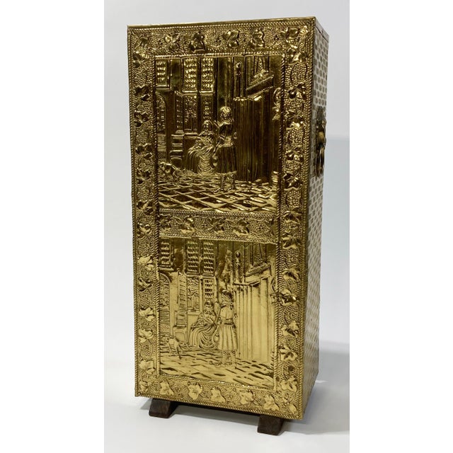 Large French repousse brass cane or umbrella stand in traditional style. Sturdy wood frame with brass overlay and regal...