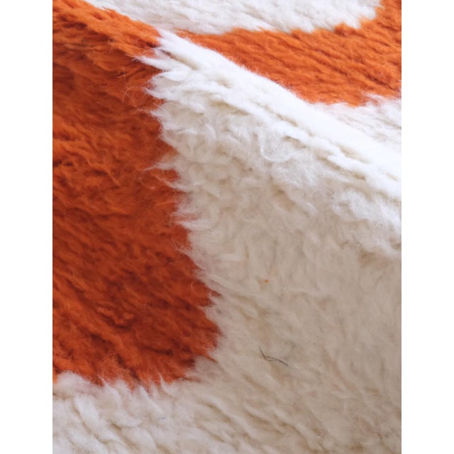 Create a cozy and modern atmosphere in your home with our Moroccan Orange Wool Rug. Measuring 9.9 x 6.5 ft and made with...