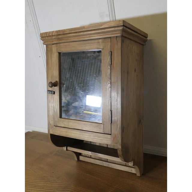 Wall Hanging Cloakroom or Bathroom Cupboard A very useful bathroom cabinet this wall hung shelved cupboard has mirrored...