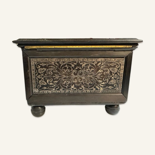 Early 18th century ebony or ebonized hardwood presentation or jewelry box with silver inlay and blue satin interior. The...