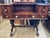 This historically important desk has carved acanthus leaf trestle legs and flame mahogany veneers, a furniture style...