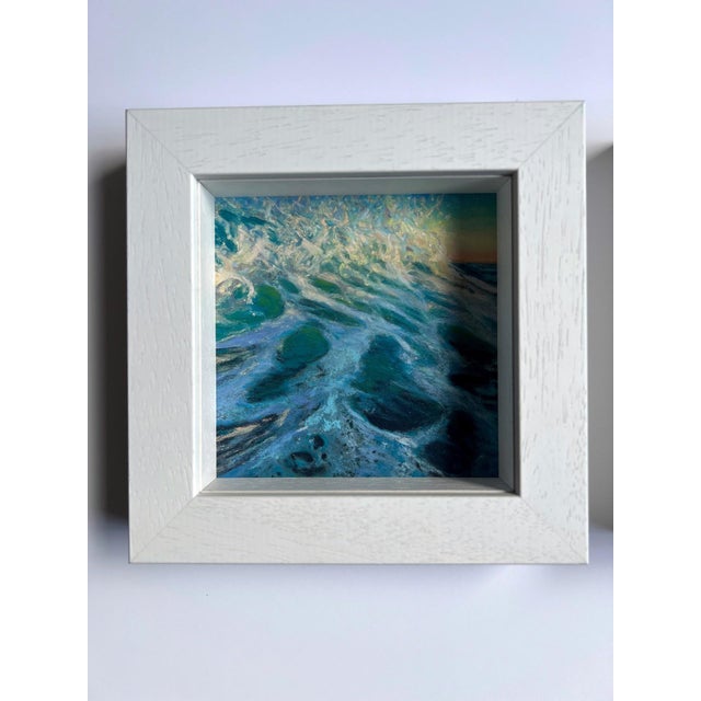 The artwork captures a dynamic wave crashing with vibrant hues of turquoise and white, evoking a sense of movement and...