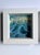 The artwork captures a dynamic wave crashing with vibrant hues of turquoise and white, evoking a sense of movement and...