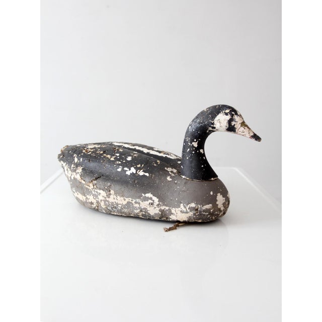 Vintage foam Canada goose decoy with a beautifully weathered painted finish that reflects years of honest use and natural...
