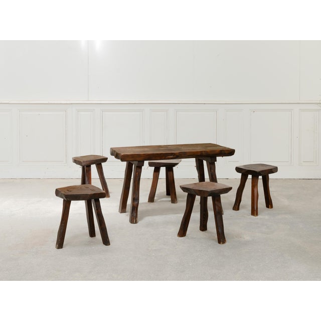 A beautiful Brutalist living room set comprising a coffee table and five stools, crafted in the 1960s from blackened pine....