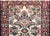 A stunning early 20th century Persian Dargazin runner with a mirrored all-over floral pattern with myriad flowers and...
