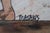 An evocative vintage textile artwork signed “Masakis,” interpreting the celebrated Boxing Children fresco excavated at the...