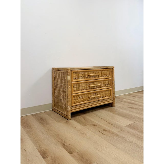 This charming vintage coastal wicker and rattan three drawer chest is a warm and beautifully crafted bedroom or living...