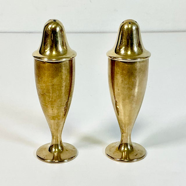We love a great simple design. This pair of brass salt and pepper shakers have great Art Deco lines. Beautifully executed...