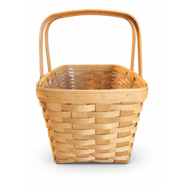 A classic vintage Longaberger Medium Market Basket, handwoven in Dresden, Ohio, from natural maple wood splints. This...