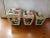 This is a 1969 Set of 3 Handmade Ceramic Canisters with Floral Motif, Flour, Sugar & Tea. They measure (from left to...