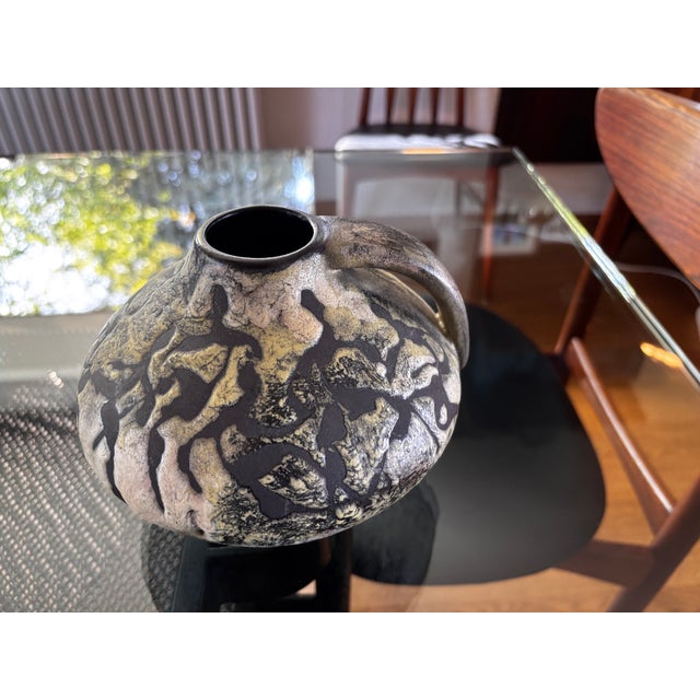 A pottery workshop vase by Gustav Sporri (1920-2016) in perfect condition, decorated with ghostly figures on an...