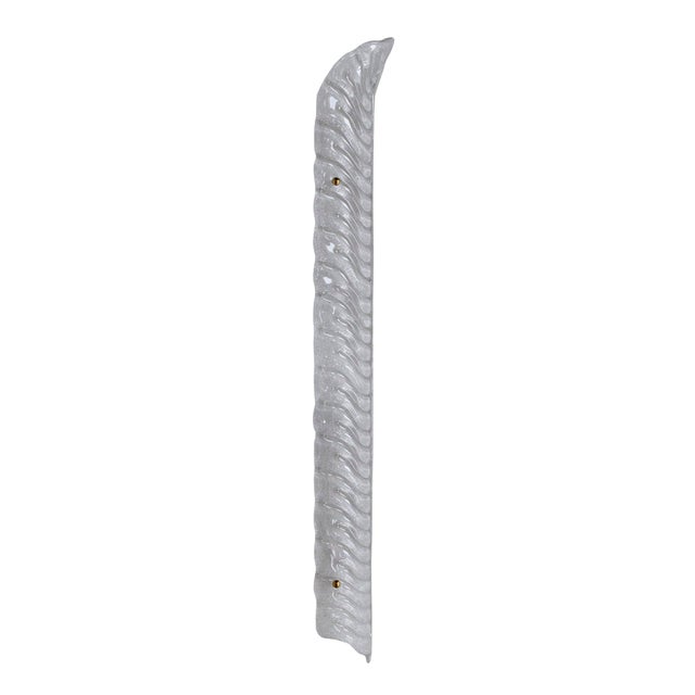 Elegant pair of wall sconces handcrafted in Italy, featuring elongated feather-shaped shades made of hand-blown Murano...
