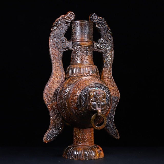 An extraordinary and monumental pair of collector's pieces: Two large carved horn vases featuring double dragon handles....