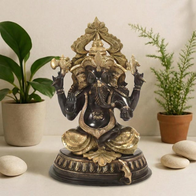 Invite the essence of wisdom and success into your home with this breathtaking 18 Inch Black and Gold Ganesha Brass...