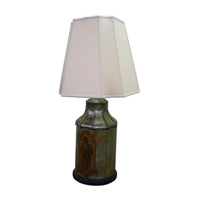 This striking pair of vintage table lamps is crafted from octagonal, tin tôle tea caddy bodies finished in a heavily...