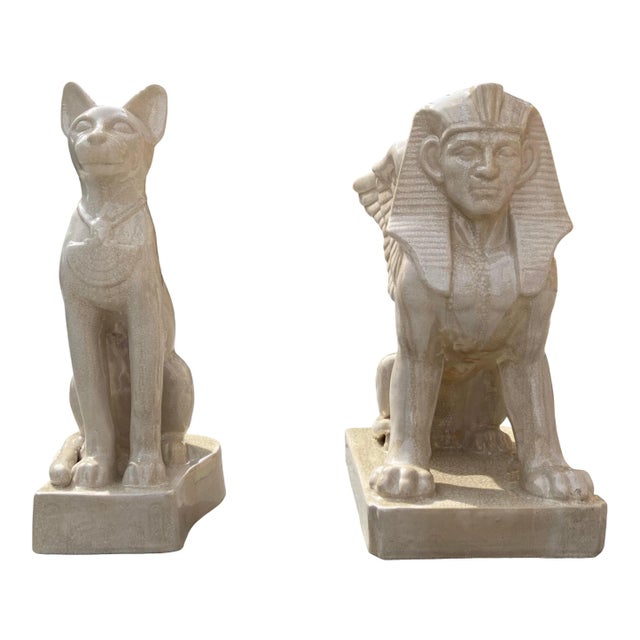 Large scale Egyptian sphinx and cat entryway statues in crackle glaze porcelain, circa 1980s. Piece dimensions: w12” x...